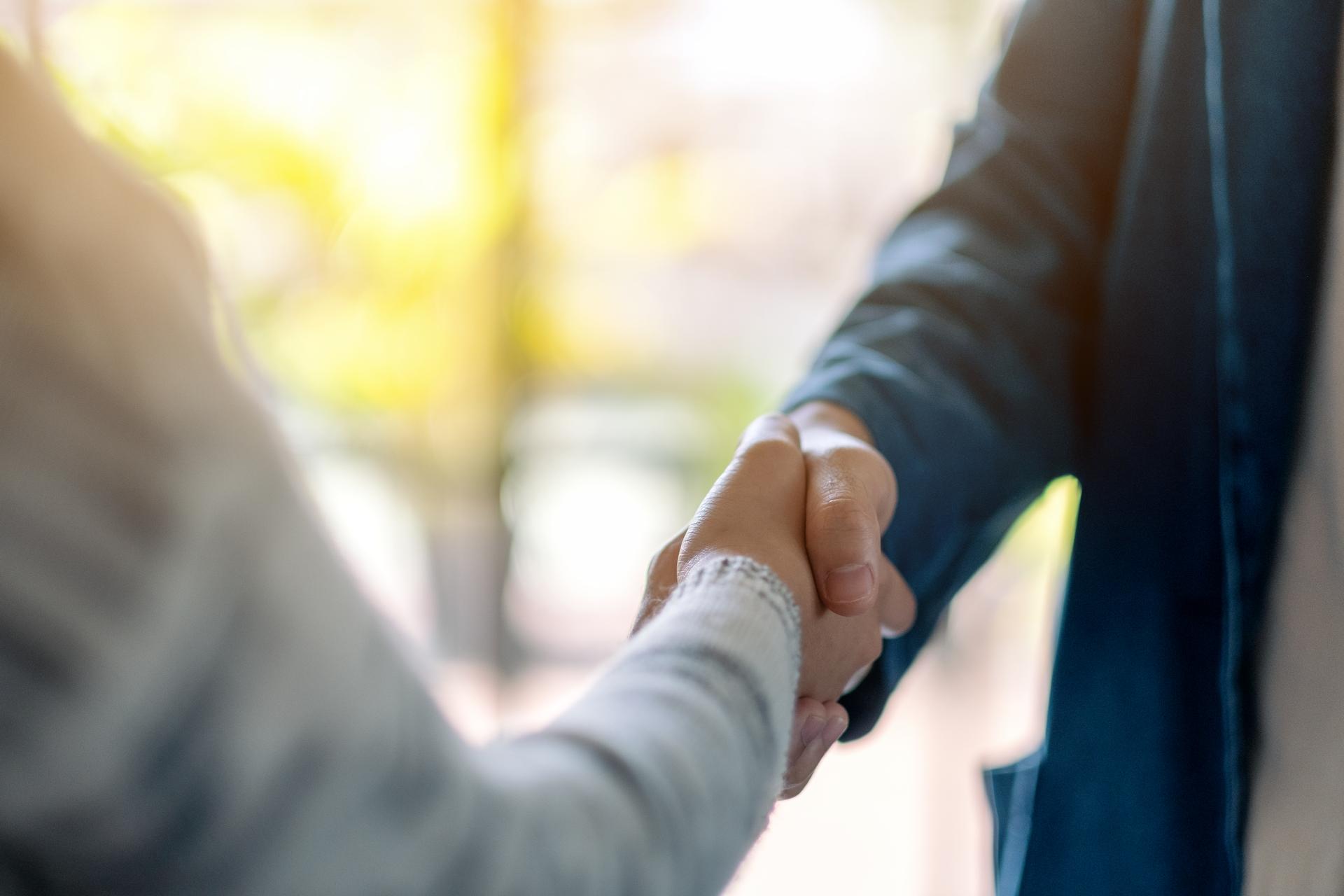 two people shaking hands